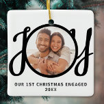 Our 1st Christmas Engaged Photo Keepsake Keramisch Ornament<br><div class="desc">This keepsake First Christmas Engaged photo ornament is decorated with the word JOY in black,  stylish script typography. Easily customizable.</div>