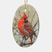 Ovaal siermiddel met een mannelijk kardinaal. keramisch ornament (Links)