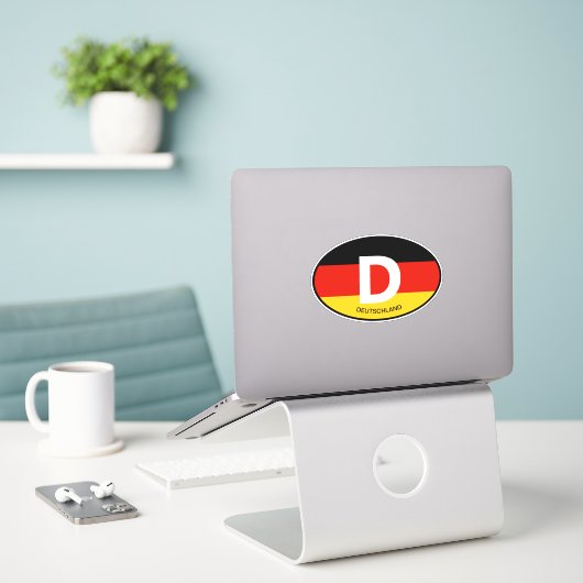 Ovale Duitse vlag landcode vinyl auto sticker (Laptop op bureau)