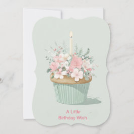 Oversized cupcake omgeven door bloemdecoraties