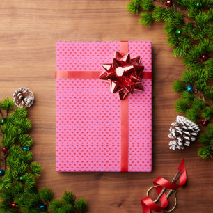Overvloed aan harten, rode harten op roze cadeaupapier
