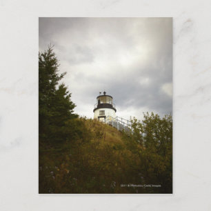 Owl's hoofdvuurtoren op een dag van de wolken briefkaart