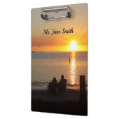 Paar zittend op Florida strand klembord (Links)