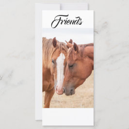 Paarden die in een graslerkaart doorboren