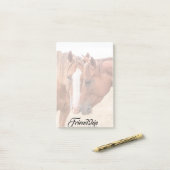 Paarden die in een weiland snuiven post-it® notes (Op bureau)