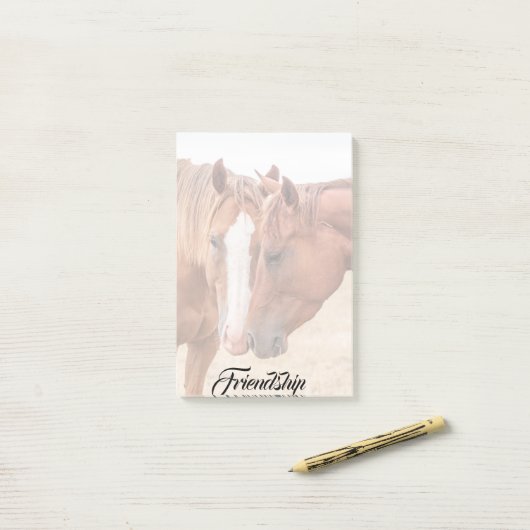 Paarden die in een weiland snuiven post-it® notes (Op bureau)