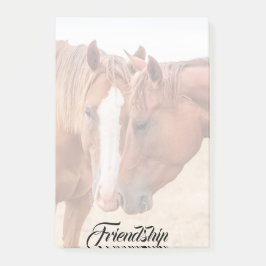 Paarden die in een weiland snuiven post-it® notes