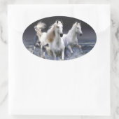 Paarden die lopen met kussens ovale sticker (Tas)