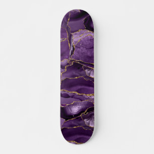 Paars en goudglitteraglaat persoonlijk skateboard