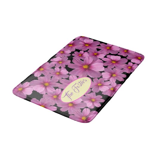 Paars kosmos-ventilatorontwerp op een zwarte achte badmat (Gekanteld)