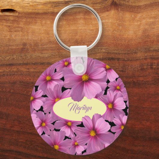 Paars kosmos-ventilatorontwerp op een zwarte achte sleutelhanger (Voorkant)