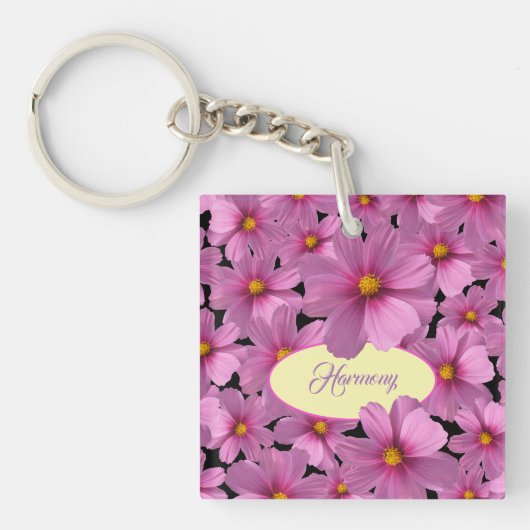 Paars kosmos-ventilatorontwerp op een zwarte achte sleutelhanger (voorkant)