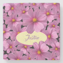 Paars kosmos-ventilatorontwerp op een zwarte achte stenen onderzetter