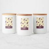 Paarse aubergines op geel voedselcontainer etiket (Flessen)