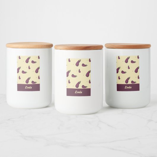 Paarse aubergines op geel voedselcontainer etiket (Flessen)