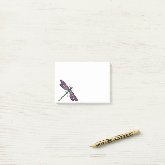 Paarse en groene dragonfly post-it® notes (Op bureau)