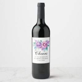Paarse en roze bloemen. Bloemstuk proost bruiloft Wijn Etiket