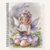 Paarse fee lezend op gras bloemen gepersonaliseerd notitieboek (Voorkant)