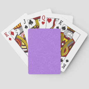 Paarse textuur oppervlak met wervelend patroon pokerkaarten