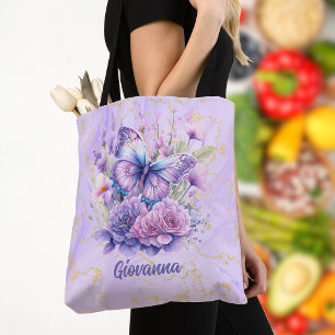 Paarse vlinder bloeiende tuin tote bag