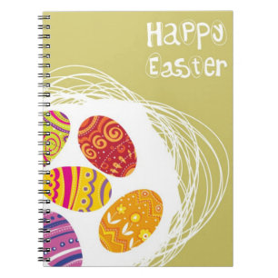 Paaseieren in nesten op groene achtergrond notitieboek