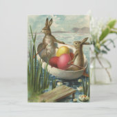 paaskonijntjes in een boot met paaseieren feestdagenkaart (Staand voorkant)