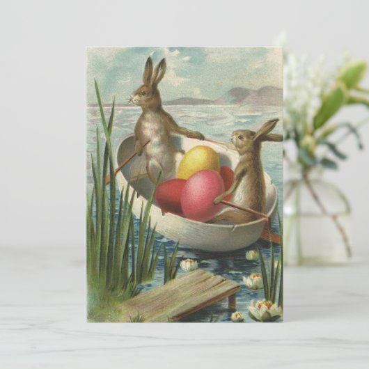  paaskonijntjes in een boot met paaseieren feestdagenkaart (Staand voorkant)