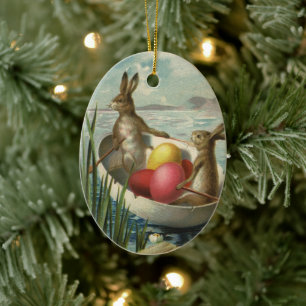paaskonijntjes in een boot met paaseieren keramisch ornament