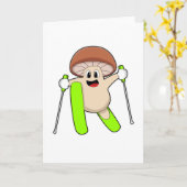 Paddenstoel als skiër met skis kaart (Gele Bloem)