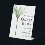 Palm Tree Bestemming Bruiloft Gast Boek teken Reclamebord Met Voetstuk<br><div class="desc">Deze palmboom bestemming bruiloft gastenboek teken ontwerp beschikt over tropische waterverf palmbomen op een heldere witte achtergrond die de dromerige sfeer van een bestemmingsbruiloft oproepen. dit ontwerp straalt de romance van zandoevers en zwaaiende palmen, ideaal voor koppels op zoek naar een echt onvergetelijke viering. Voor gepersonaliseerde coördinatie of vragen, aarzel...</div>