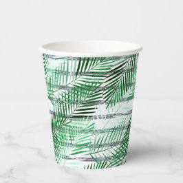 Palmbladeren op een gestreepte zwart-witte achterg papieren bekers