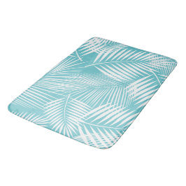 Palmbladeren op turquoise badmat