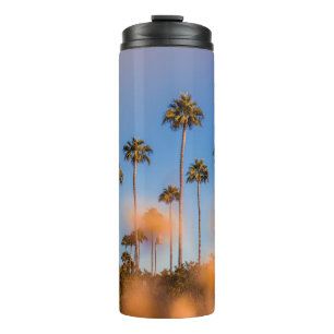 Palmboom onder blauwe hemel thermosbeker