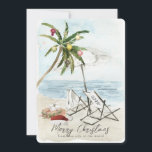 Palmboom & strandstoelen Tropische vakantie Kaart<br><div class="desc">Deze kerstkaart "Merry Christmas from this side of the world" is voorzien van een palmboom met ornamenten en lichten, een paar strandstoelen onder de paraplu op een zandstrand in waterverf. De achterkant heeft palmbomen en oceaan in waterverf. Personaliseer het voor uw behoeften. Je kunt bijpassende producten vinden in mijn winkel....</div>