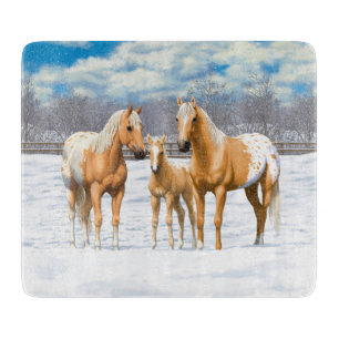 Palomino appaloosa paarden bij sneeuw snijplank