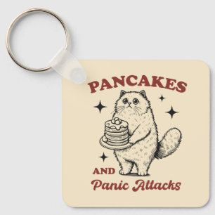 Pannenkoeken en paniekaanvallen grappige kat sleutelhanger