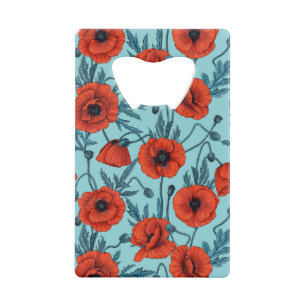 Papavers, rood en blauw op zwembad blauw creditkaart flessenopener