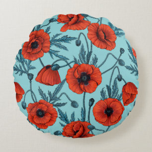 Papavers, rood en blauw op zwembad blauw rond kussen