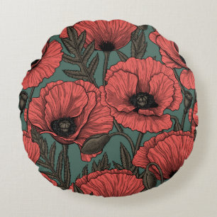 Papavertuin in koraal-, bruin- en pijngroen rond kussen