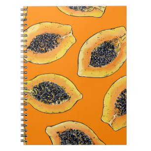 Papaya plakjes op sinaasappel notitieboek