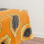 Papaya plakjes op sinaasappel tafelkleed (Voorbeeld)