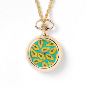 Papaya snijwonden op turquoise horloge