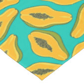 Papaya snijwonden op turquoise tafelkleed (Gekanteld)
