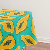 Papaya snijwonden op turquoise tafelkleed (Voorbeeld)