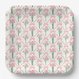 Papieren borden met roze strikken en bloemen voor  bordje