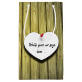 Papierhandgeschreven script, bijtend klein cadeauzakje (Achterkant)