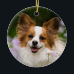 Papillon Dog Romantic Cute Portrait Keramisch Ornament<br><div class="desc">Een Witte en Rode Papillon hond die in een weide zit omringd door Cuckooflower. Papillon is een waarschuwend,  vriendelijk en zeer slim speelgoed ras. Deze mooie bril werd gefotografeerd door Katho Menden,  deze keramische kerstsieraad is een betoverend speciaal cadeauidee voor doglovers.</div>
