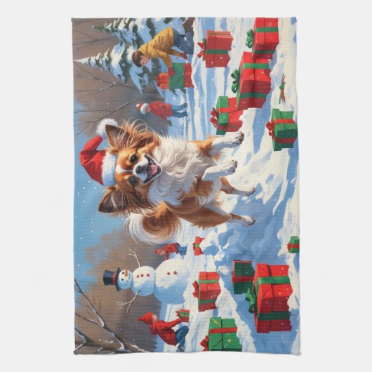 Papillon hond loopt in de sneeuw met kerst Pet Theedoek (Verticaal)