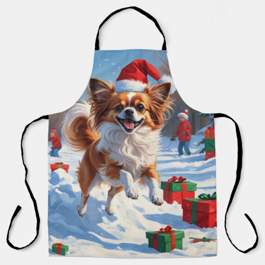 Papillon-hond rent in de sneeuw met kerstmuts schort (Voorkant)