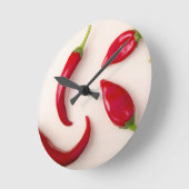 Paprika's van hete rode Spaanse peper op een licht Ronde Klok (Hoek)